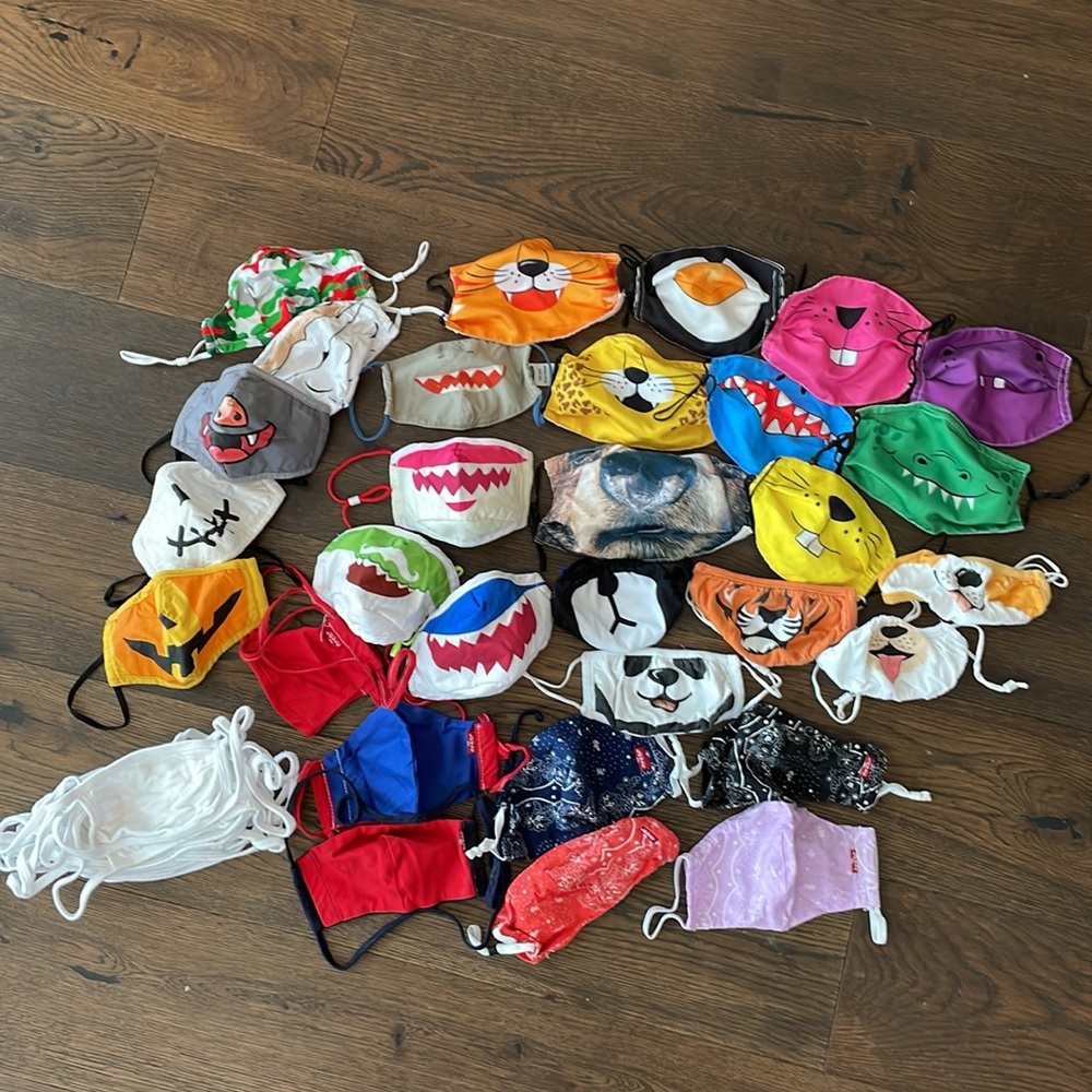 Lot of a variety of 30+ kid size masks (+15 white cotton masks)